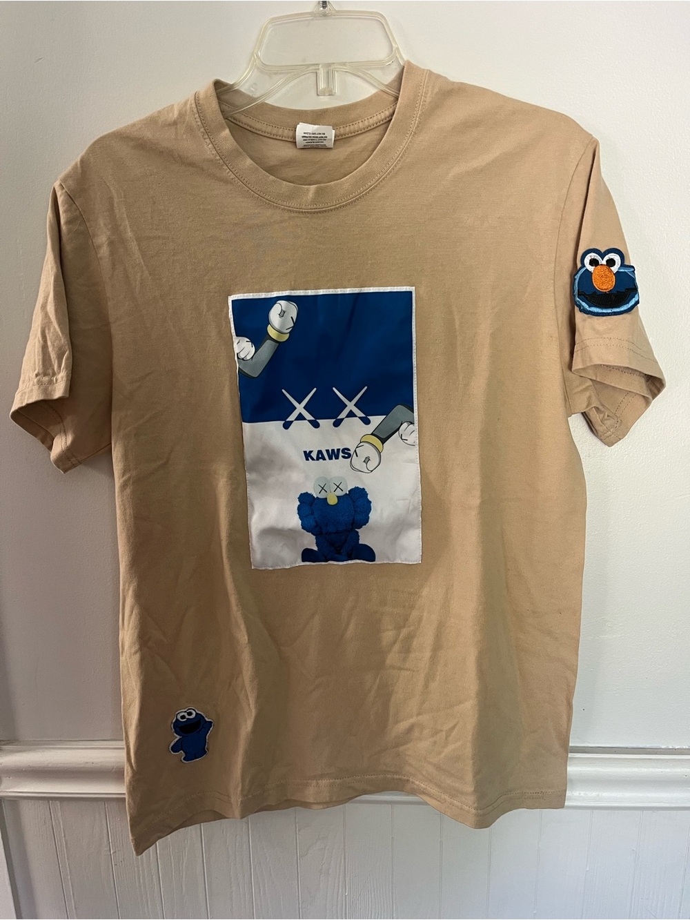 KAWS Kids Tan Tee with Blue Character Panel and Patches